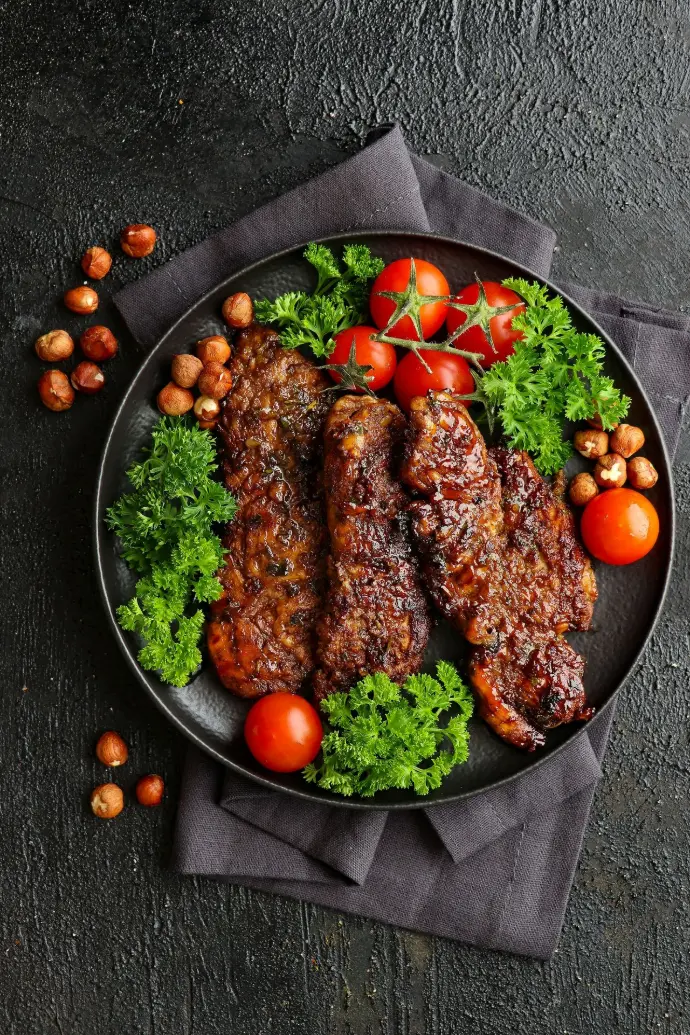 a plate of meat and vegetables on a table